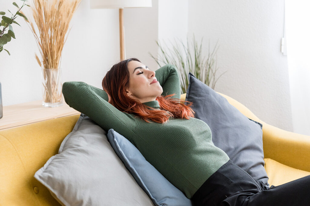 women resting at home on sofa.