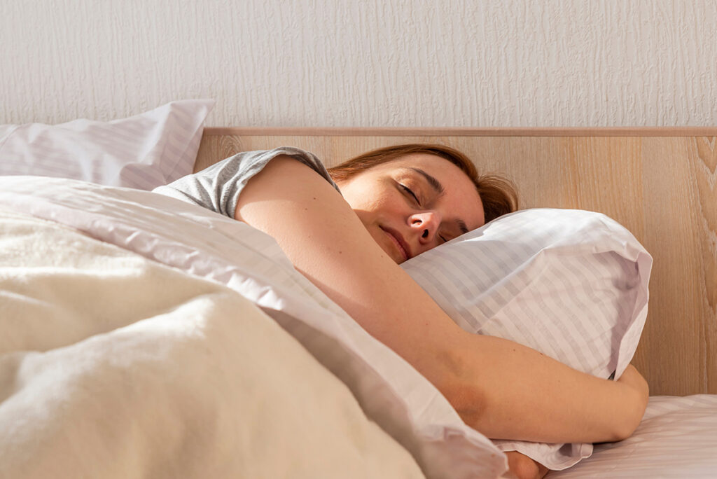 young women at home resting in bed after surgery